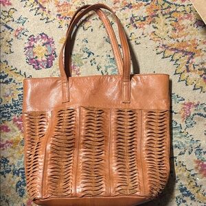 brown leather tote bag by Day &‎ Mood featuring a twisted woven front design